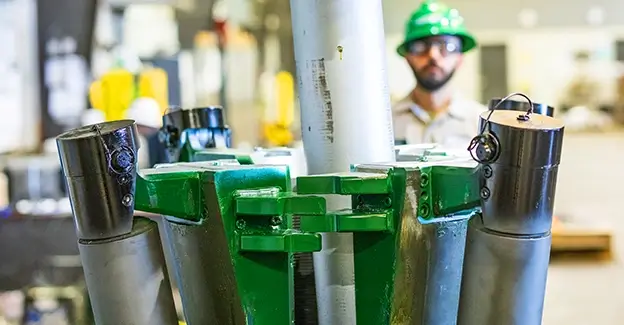 A white pipe being inserted into a FASTR® system