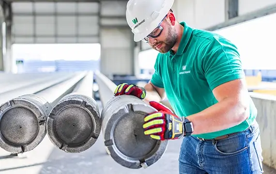 A Workstrings worker looking over heavy landing string casings
