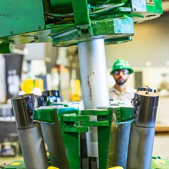 A white pipe being inserted into a FASTR® system