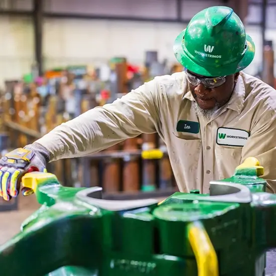 A Workstrings worker opening Drill Collar Clamps