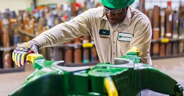 A Workstrings worker opening Drill Collar Clamps