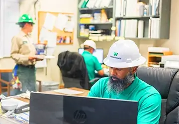 Workstring workers working at their desks in an office